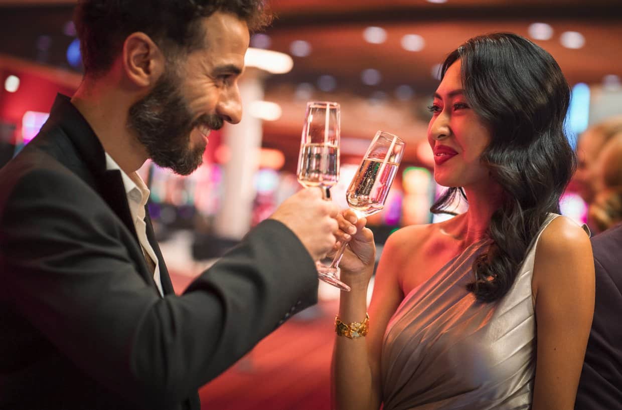 Couple at bar with champagne