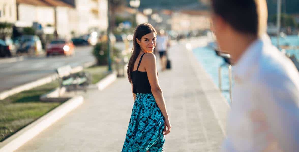 Woman looking behind her