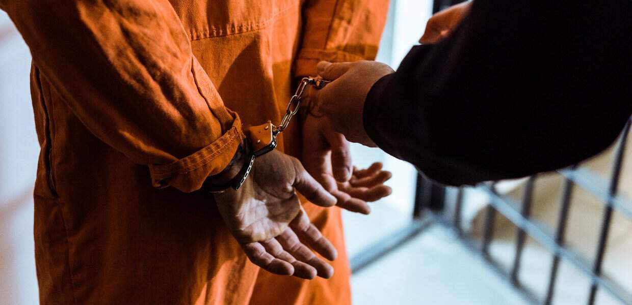 Photo of a man in handcuffs