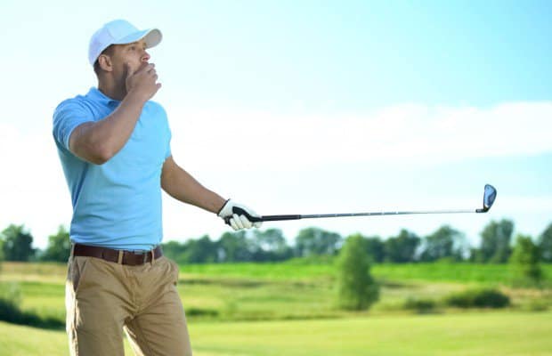 A man playing golf