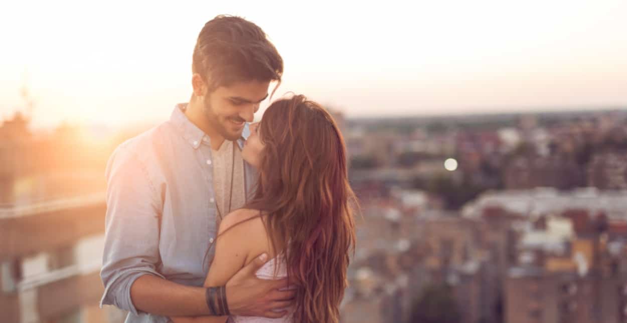 A couple embracing under the sunset